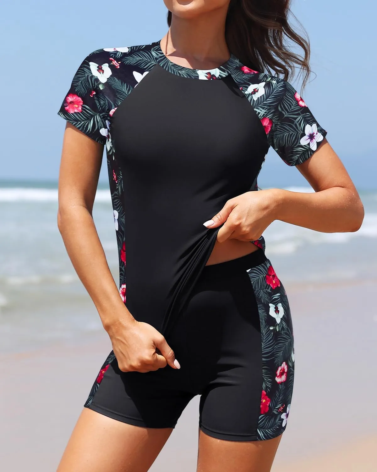 Daci Women's Two Piece Rash Guard - Short Sleeve Swim Shirt with Built-in Bra and Shorts with Pockets